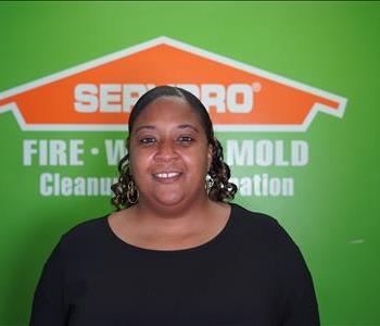 Want in front of SERVPRO logo and green wall