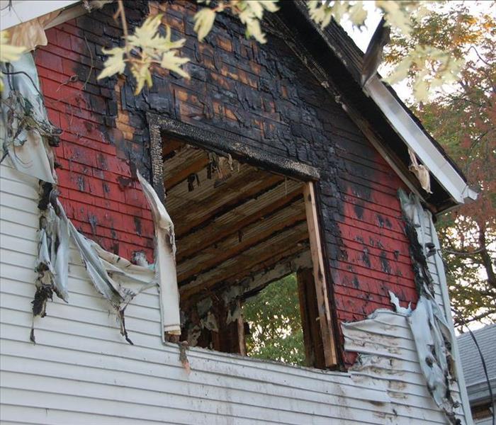 The front of a burned house